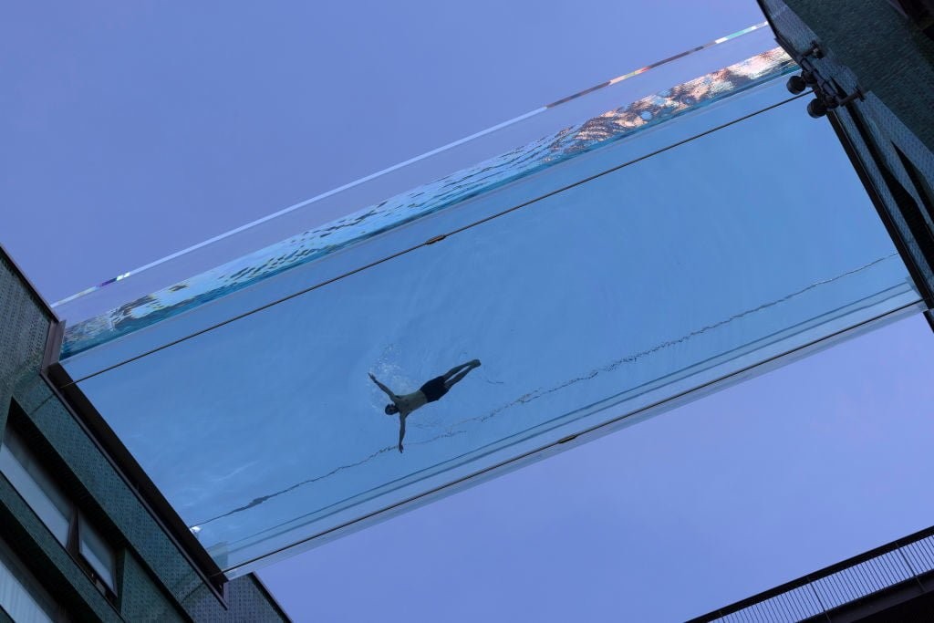 Watch swimmers enjoy a dip in this incredible sky pool