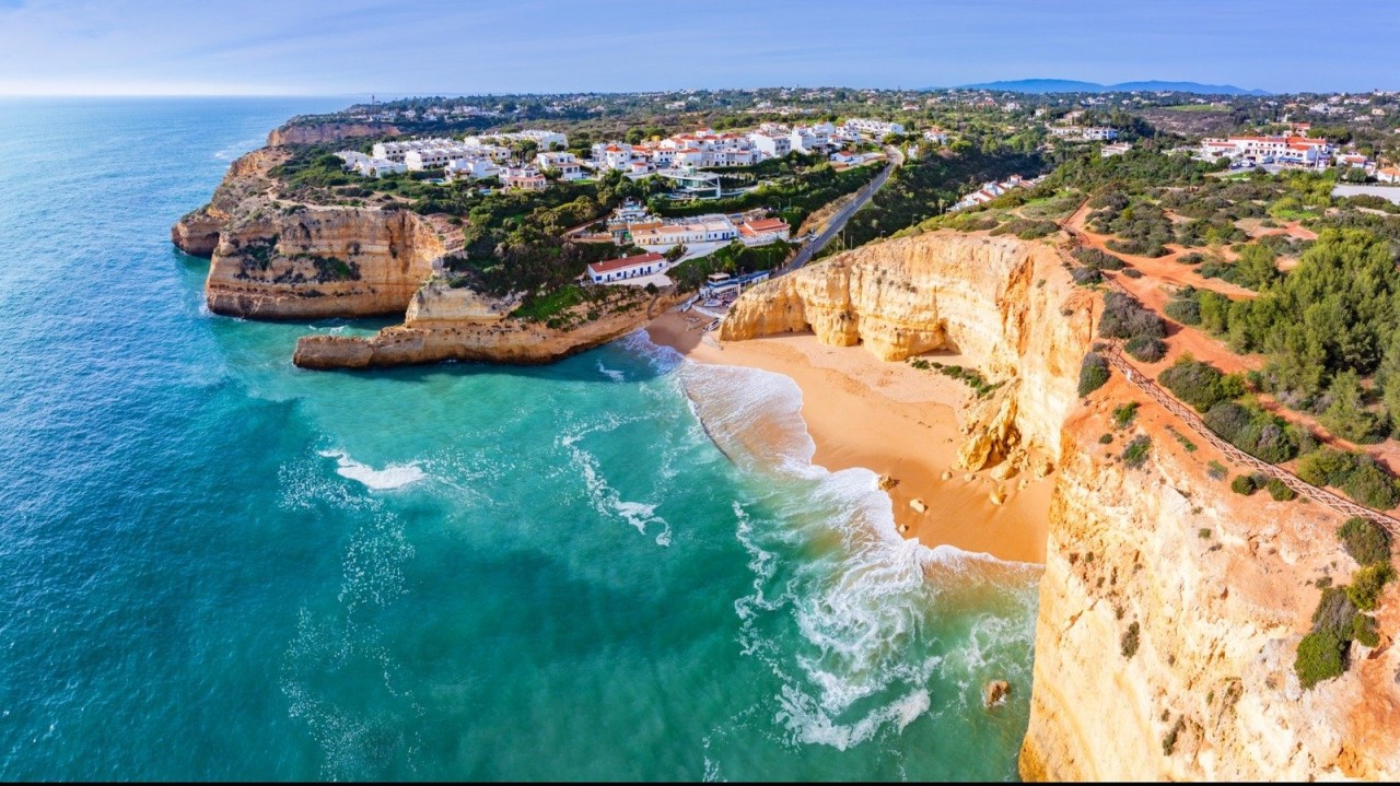 Portugal's Best-Kept Secret Beach Is A Hidden Paradise Of Cliffs, Golden Sands, And Calm Water