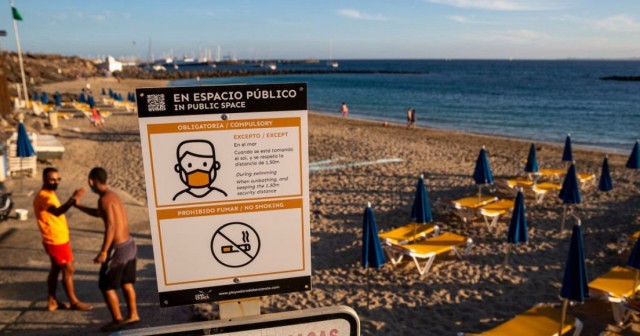 Spain drops face mask rule for people sunbathing and swimming