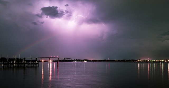 Photographer Captures Rare Sight of Double Moonbow Colliding With Bolt of Lightning