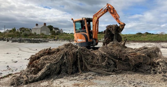 Several tonnes of 'ghost net' removed from Co Down beach with a digger