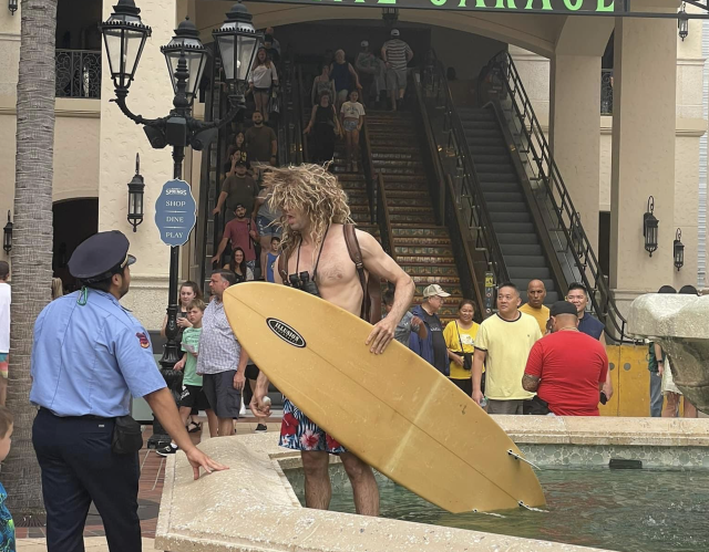Man Attempts to Surf in Water Fountain at Disney Springs - WDW News Today